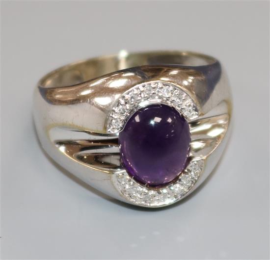 A 10k white gold, amethyst and diamond set dress ring, size Q/R.